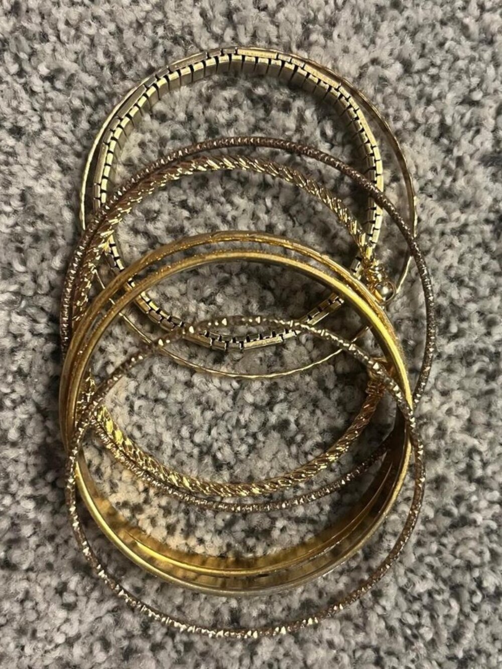 Set of six gold tone bangles